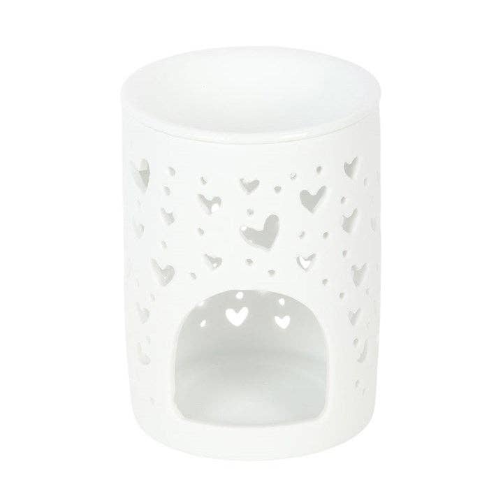 Quemador de cera blanco, con diseño recortado en forma de corazón